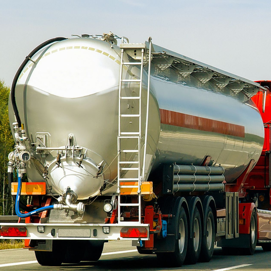 Heavy duty vehicle hose carriers for trucks and tankers